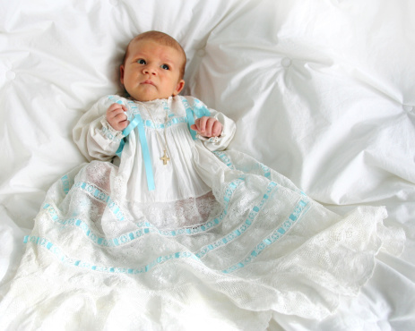 2 month old baby boy in a vintage baptismal gown.