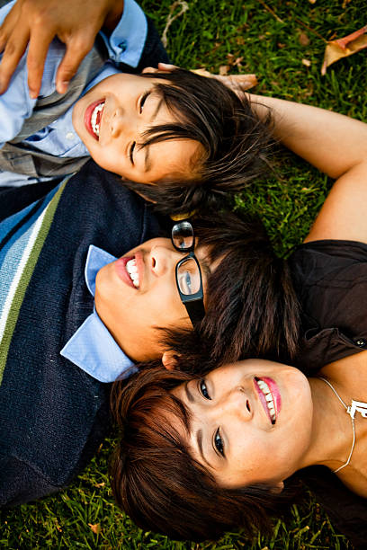 istock family laying down on grass looking up 173636773