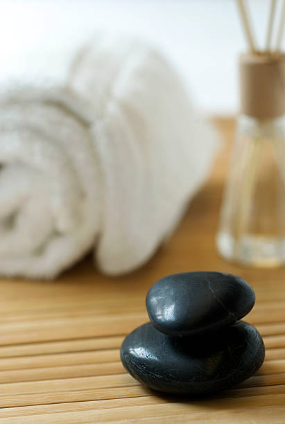 istock Massage Stones on Bamboo in Zen Spa for Aromatherapy 173636961