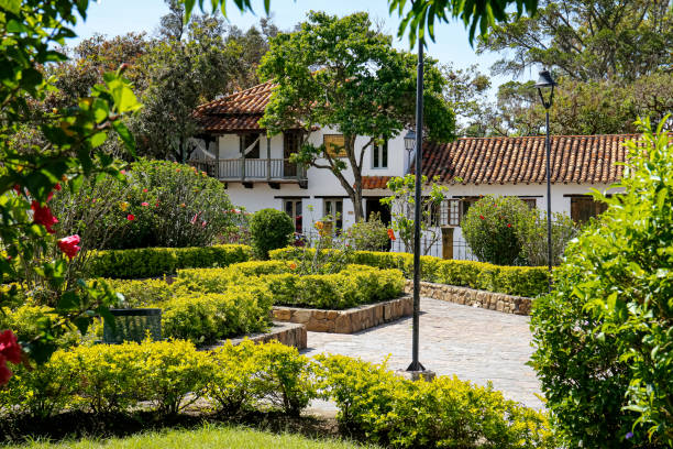 Neat park area with a traditional building in the back on a sunny day, Villa de Leyva, Colombia Neat park area with a traditional building in the back on a sunny day, Villa de Leyva, Colombia boyacá department photos stock pictures, royalty-free photos & images