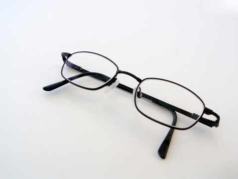 Some reading glasses with the arms closed.