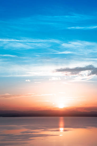 istock Beautiful sunset over lake with some clouds 173638443
