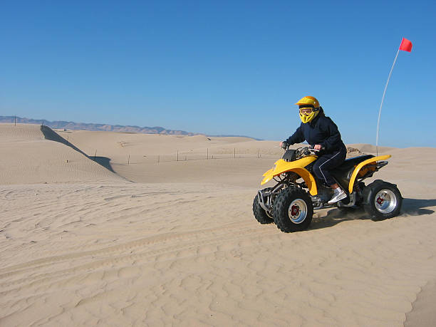 Riding the dunes stock photo