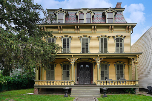 Hudson, NY - August 2023:  ornate 19th century American house with full width porch