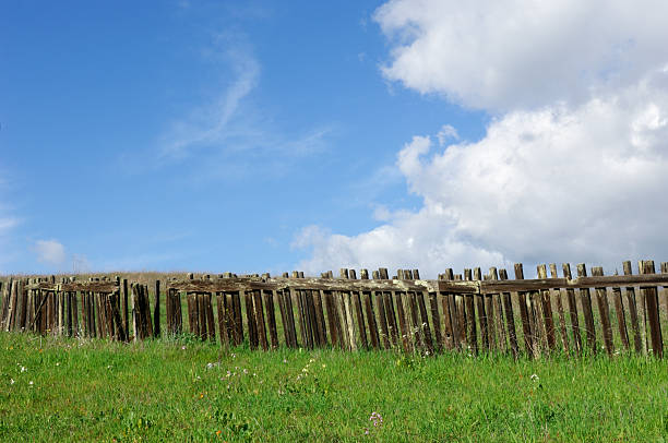 istock Rustic Wood Fence Against Cloudy Blue Sky 173638894