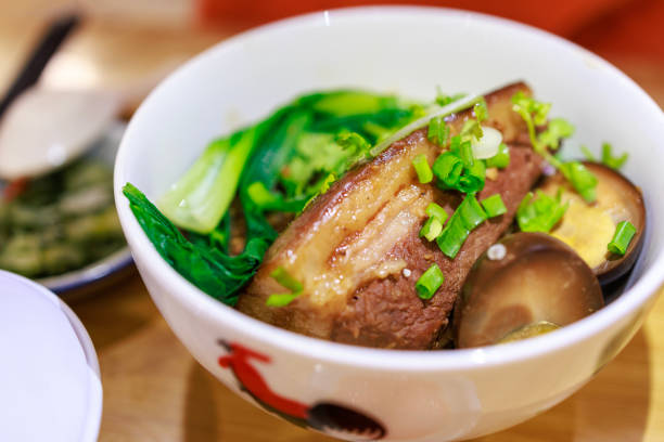 Taiwan's traditional braised pork belly with pickled vegetables, egg, and rice in a close-up
