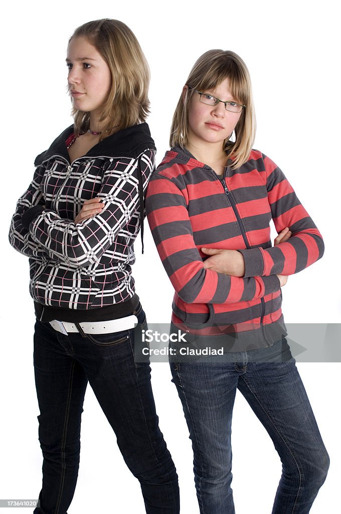 Sisters "Two teenager girls, 12 and 14 years old, having a conflict.Similar pics and more of this family:" Adolescence Stock Photo