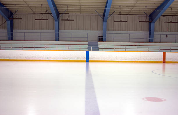 A blue and red line on an ice rink View of blue line of an empty ice hockey rink. skate rink stock pictures, royalty-free photos & images