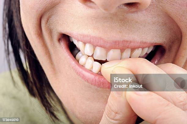 Close Up Of A Woman Biting Her Nails Stock Photo - Download Image Now - Shock, Women, Nail Biting