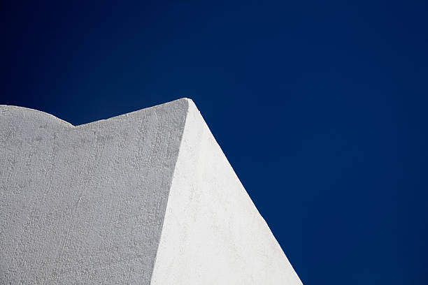 istock White Building against Blue Sky-Click for more exteriors 173645161