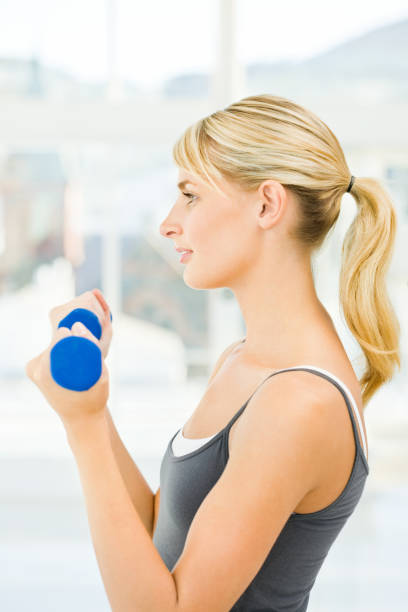 istock Side view of a young woman exercising 173645165