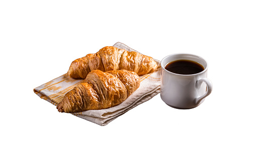 Croissants and coffee, food, appetizers, snacks, desserts, breakfast, dinner and coffee laid out on white background.