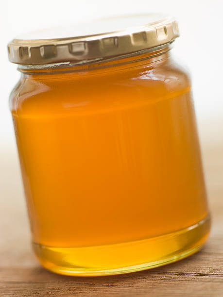 istock Jar Of Honey And Spoon 173645533