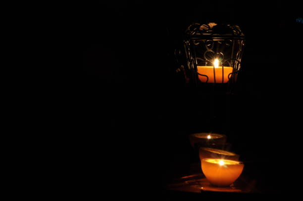 istock Lamp, candle shining in the darkness. Challis flame. Artistic composition. Lighting. 1736456930