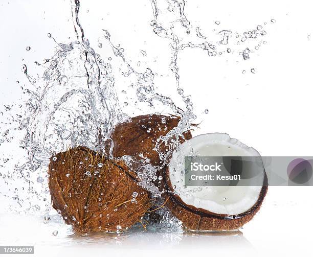 Coconut With Splashing Water Stock Photo - Download Image Now - Bright, Coconut, Cut Out