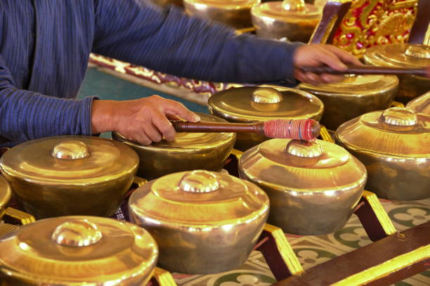istock Indonesian musician playing traditional instruments 1736461771