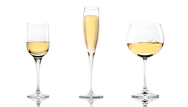 Three White Wines Chablis, Champagne and Chardonnay in glasses isolated on a white background   chardonnay grape stock pictures, royalty-free photos & images