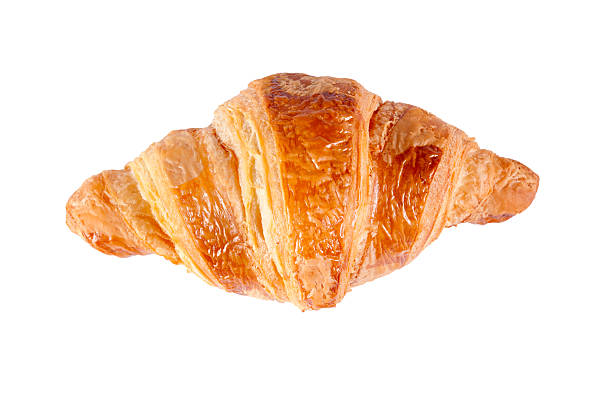 Single croissant Single croissant from above isolated on white background croissant stock pictures, royalty-free photos & images