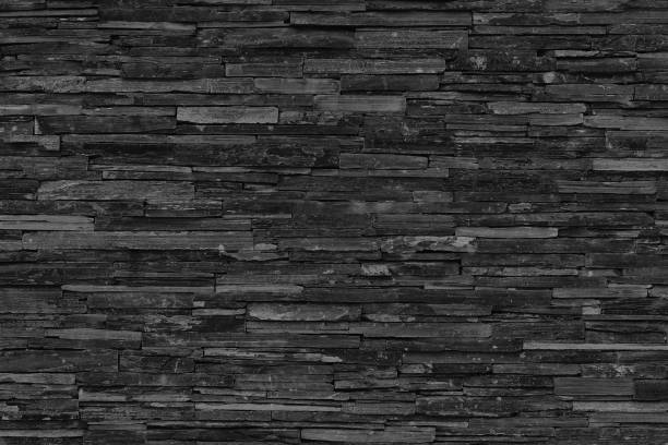 istock Dark grey black slate texture in natural pattern with high resolution for background and design art work. Black stone wall. 1736489684
