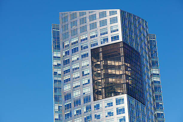 istock Beautiful modern office building against the blue sky 173649737
