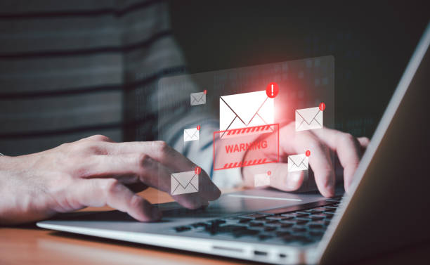 istock Business man using smartphone and computer that show warning sign after got attack phishing email by malware from hacker that commit cyber crime or software crash to cause an error. 1736506240