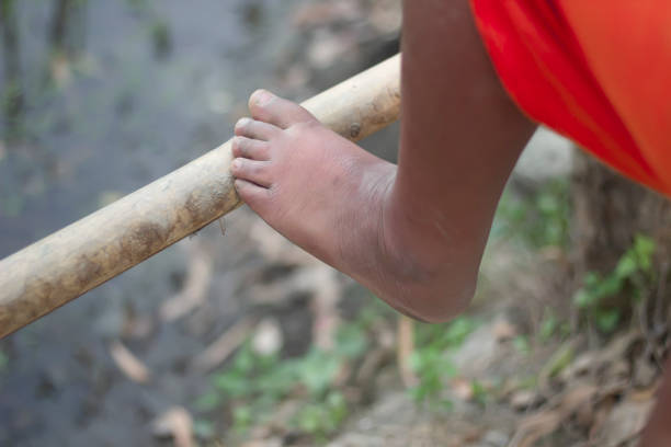 istock A man puts his feet behind bamboo and blurred background 1736510513
