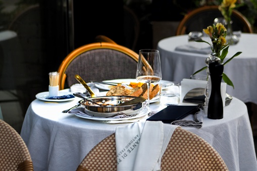 Black and gold color Elegant table set for Wedding celebration reception in barn or luxury dinner party