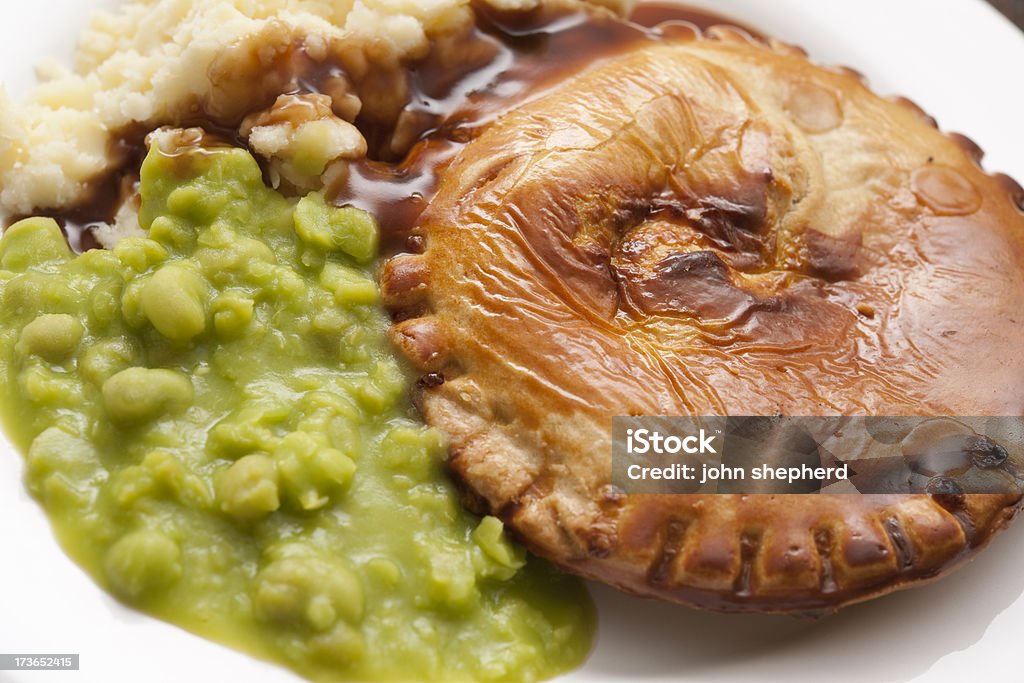 pie, mash and mushy peas from above Gravy Stock Photo