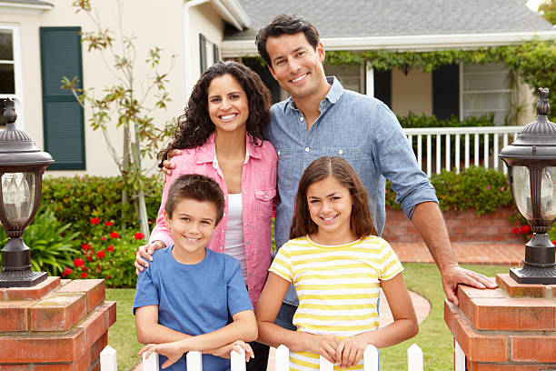 istock Hispanic family outside home 173653423