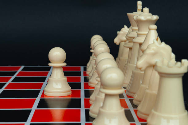 istock Selective view of chess pawn moving toward for battle. Strategy and tactic concept 1736546815