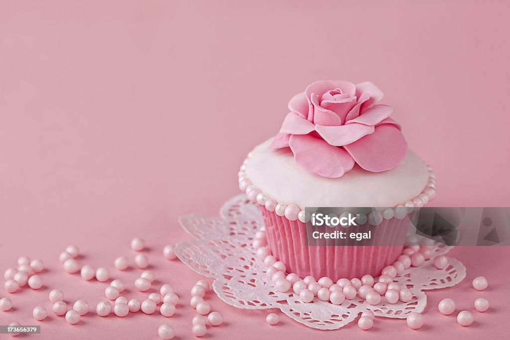 Cupcake with pink flowers Cupcake with pink flowers on a stand Antique Stock Photo