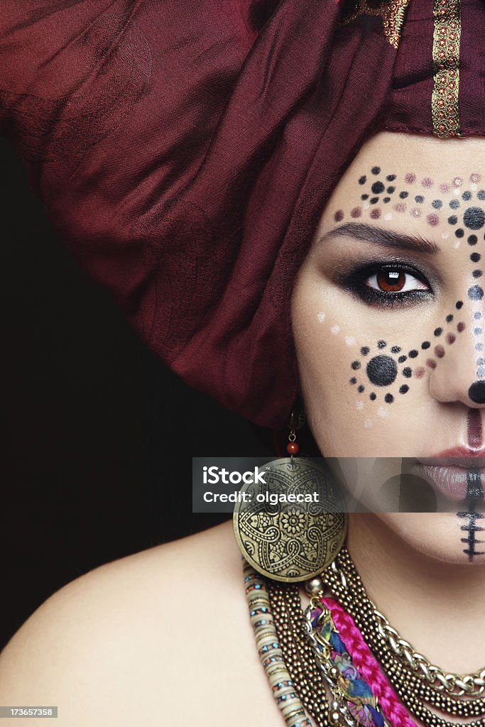 Face paint Close-up portrait of young beautiful woman with traditional Berber face paint and turban Berbers Stock Photo