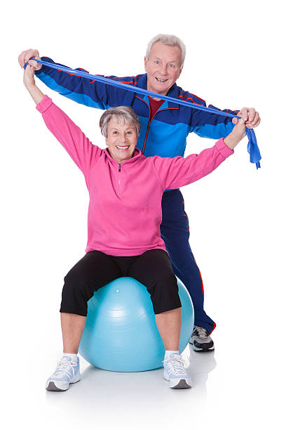 istock An older couple exercising together 173659180
