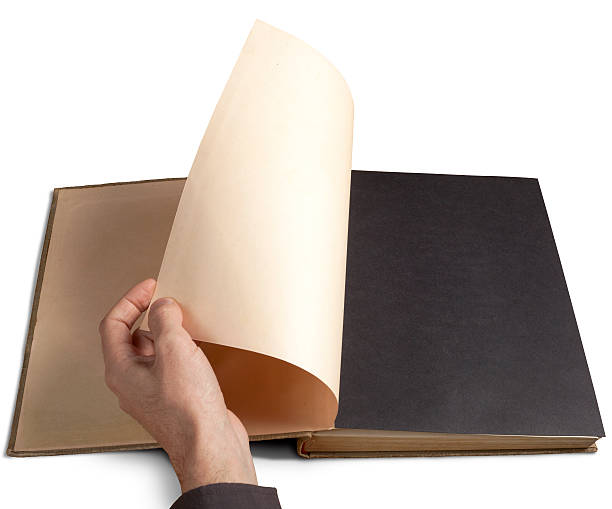 istock Left hand flicking the first page of a book 173659443