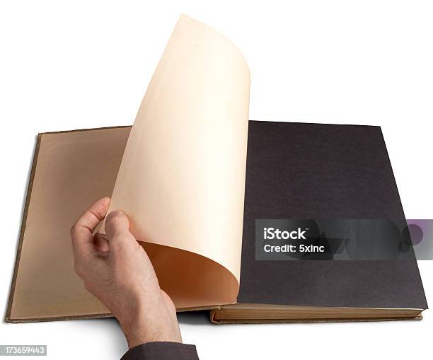 Left Hand Flicking The First Page Of A Book Stock Photo - Download Image Now - Black Color, Blank, Book