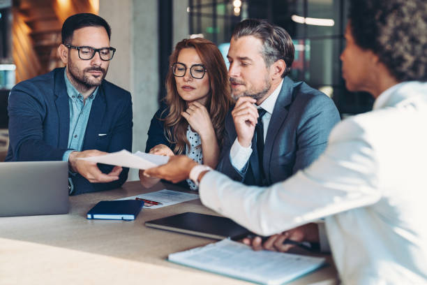 istock Entrepreneurs looking at financial report during meeting 1736596523