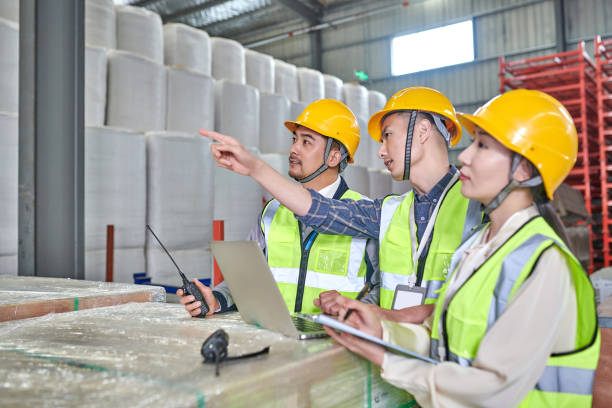 istock Three Asian Worker Using Laptop and Discussion at Cotton Warehouse 1736605071