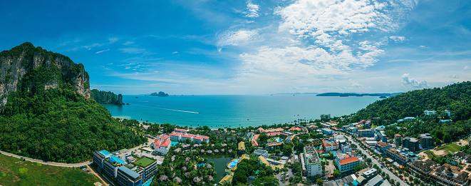 Panoramic aerial view of Ao Nang  is seen from above on sunny day, look out from city to the ocean.  Ao Nang beach, Krabi, Thailand.