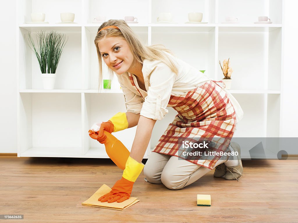 It`s time for cleaning Cheerful housewife enjoys in cleaning. Kneeling Stock Photo