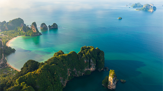 Aerial View over the limestone peaks Looking out at the vast ocean and island at sunrise.  Ao nang, \nPai Plong, Tonsai, and Railay beach. Krabi, Thailand.