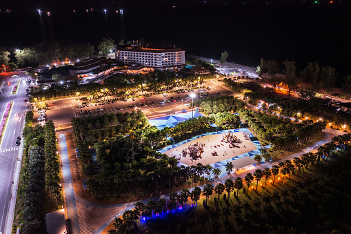 Aerial drone view of park and playground at night near Samila beach, Mueang Songkhla, Thailand.