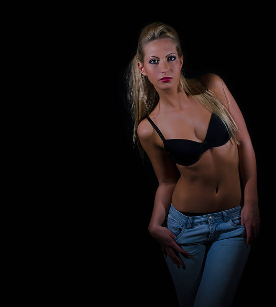 istock Sexy lady in bra and jeans posing 173665790