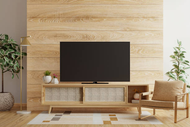 안락의자와 액세서리가 있는 거실의 나무 벽, tv 룸 - flat screen audio 뉴스 사진 이미지