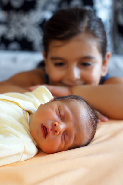 istock little girl with her brother 173667865