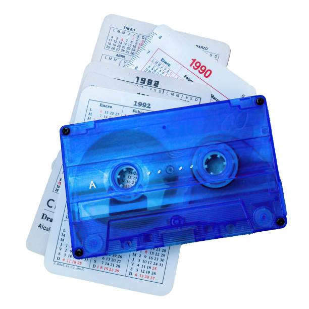 Cassette tape together with calendars from the 1990s. Music from the 90's. Cassette tape together with calendars from the 1990s. Music from the 90's. 1980 1989 stock pictures, royalty-free photos & images