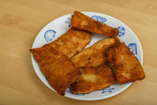 istock Fried pieces of fish lie on a plate 1736697734