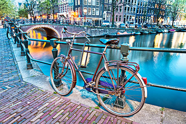 istock Night Scene with Bicycle and Water Canal in Amsterdam 173670248