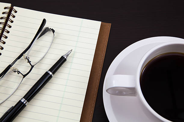 istock Cup of coffee and book 173670392