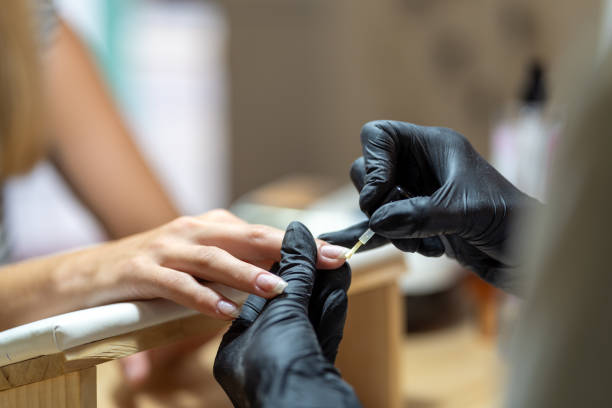 istock Two women in a beauty manicure procedure 1736715924