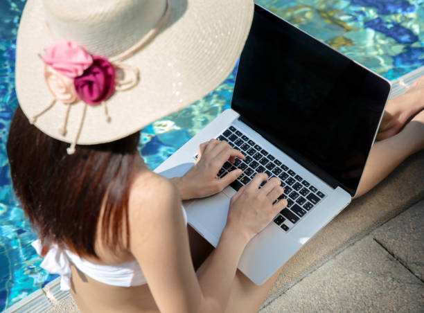 istock A woman travels to work while relaxing in a bikini. at the beach 1736717228